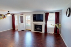 open space, great room layout, hardwood floors, gas fireplace, tile surround